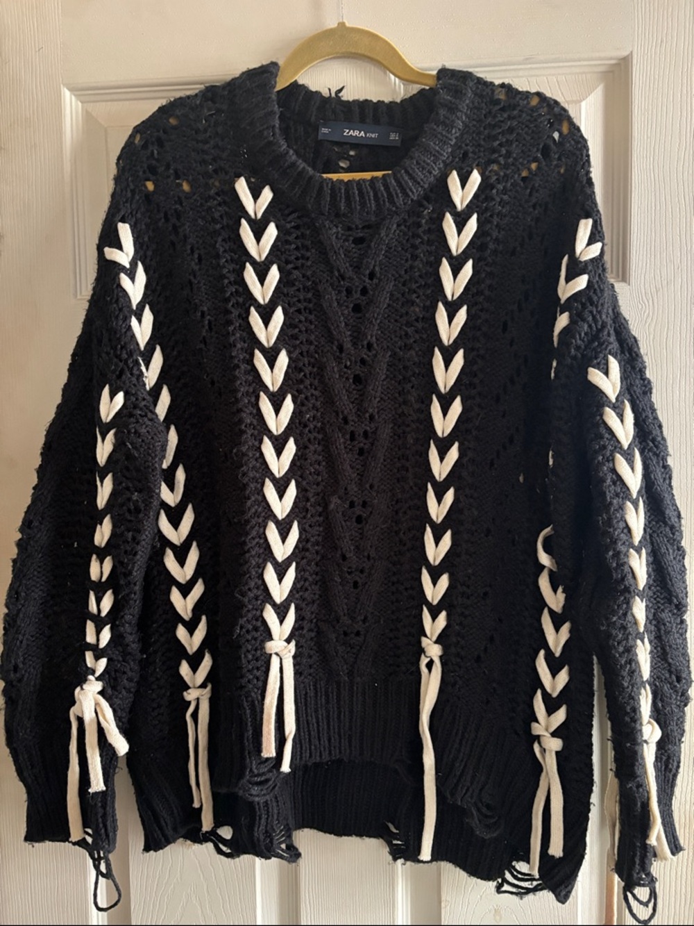 Zara black chunky distressed sweater with white braided lacing throughout